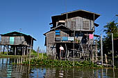 Inle Lake Myanmar. All the buildings are constructed on piles. Residents travel around by canoe, but there are also bamboo walkways and bridges over the canals, monasteries and stupas. 